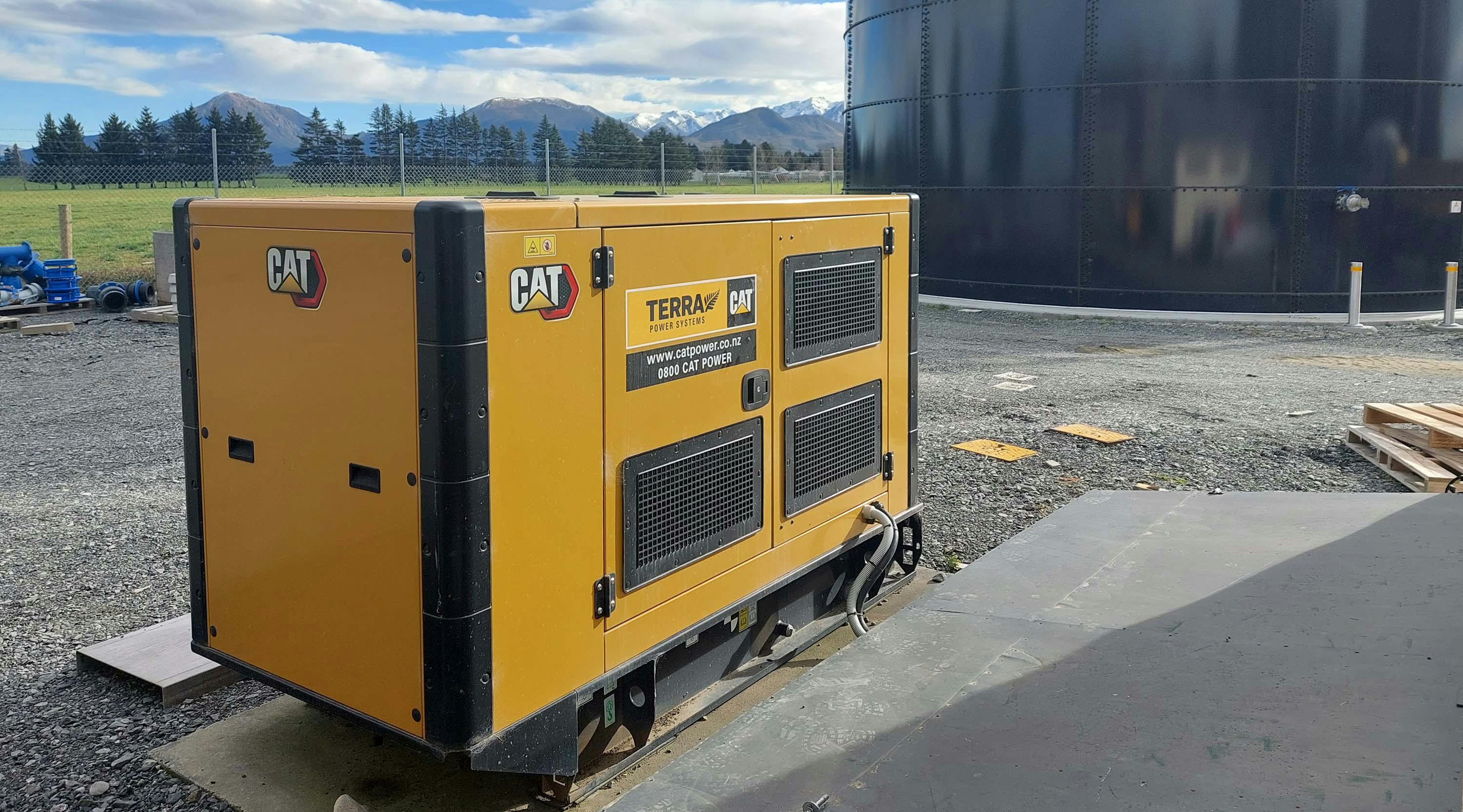 Terra Cat Power Generator Set in front of water tank